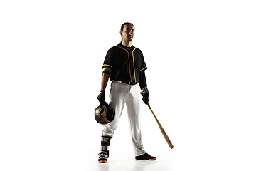 Image showing Baseball player, pitcher in a black uniform practicing on a white background.