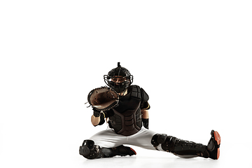 Image showing Baseball player, pitcher in a black uniform practicing on a white background.