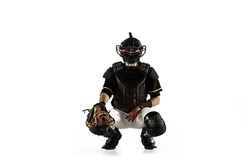 Image showing Baseball player, pitcher in a black uniform practicing on a white background.