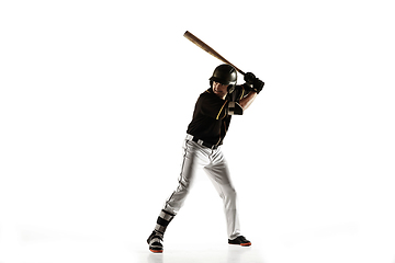 Image showing Baseball player, pitcher in a black uniform practicing on a white background.