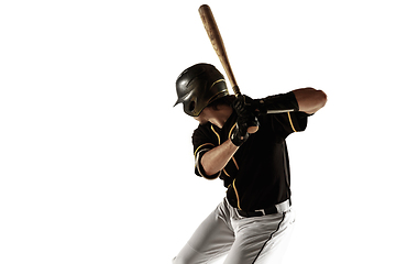 Image showing Baseball player, pitcher in a black uniform practicing on a white background.