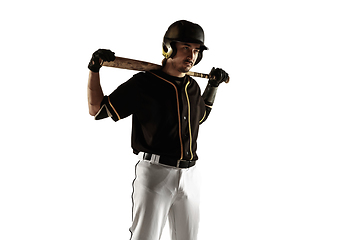 Image showing Baseball player, pitcher in a black uniform practicing on a white background.