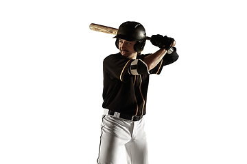 Image showing Baseball player, pitcher in a black uniform practicing on a white background.