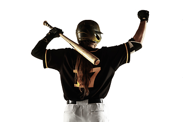 Image showing Baseball player, pitcher in a black uniform practicing on a white background.