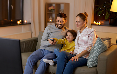 Image showing happy family watching tv at home at night