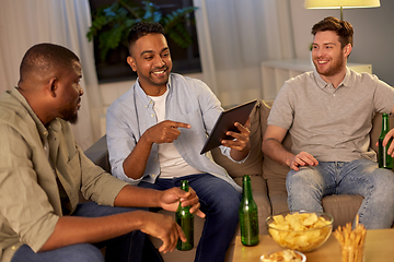 Image showing male friends with tablet pc drinking beer at home