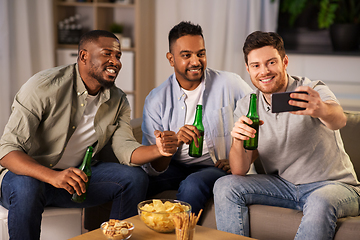 Image showing male friends with smartphone taking selfie at home