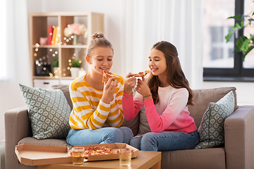 Image showing happy teenage girls eating takeaway pizza at home