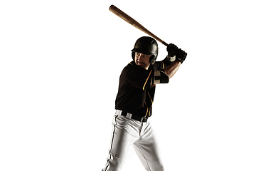 Image showing Baseball player, pitcher in a black uniform practicing on a white background.