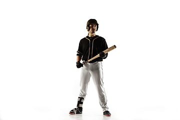 Image showing Baseball player, pitcher in a black uniform practicing on a white background.