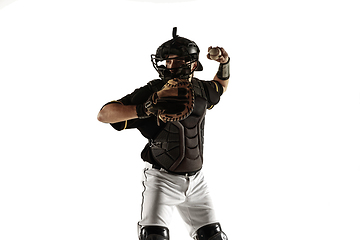 Image showing Baseball player, pitcher in a black uniform practicing on a white background.