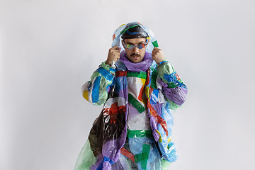 Image showing Man addicted of sales and clothes, wearing plastic, recycling concept