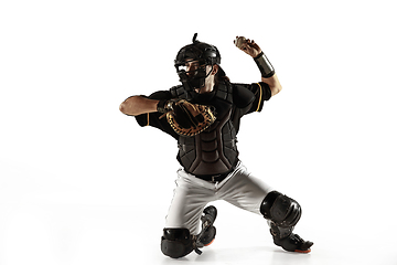 Image showing Baseball player, pitcher in a black uniform practicing on a white background.