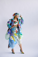 Image showing Woman addicted of sales and clothes, wearing plastic, recycling concept