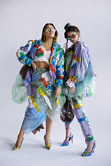 Image showing Women addicted of sales and clothes, wearing plastic, recycling concept