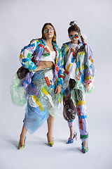 Image showing Women addicted of sales and clothes, wearing plastic, recycling concept