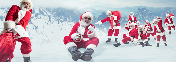 Image showing Emotional Santa Clauses greeting with New Year and Christmas, copyspace