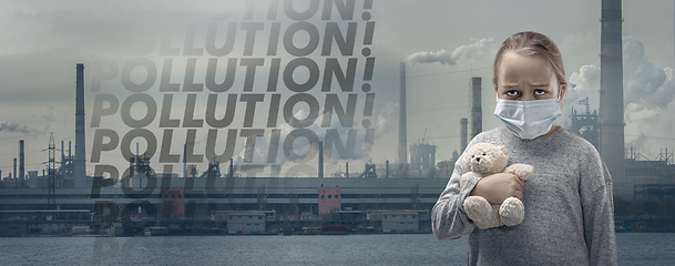 Image showing Caucasian girl wearing the respiratory protection mask against air pollution and dusk with factories on background