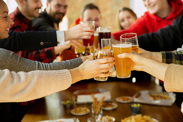 Image showing Happy co-workers celebrating while company party and corporate event