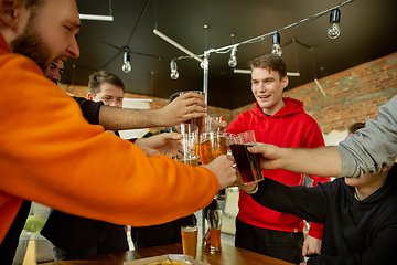 Image showing Happy co-workers celebrating while company party and corporate event