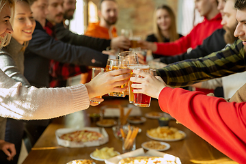 Image showing Happy co-workers celebrating while company party and corporate event