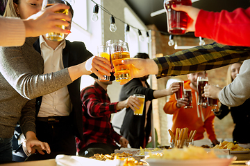 Image showing Happy co-workers celebrating while company party and corporate event