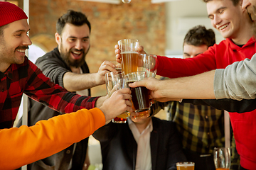 Image showing Happy co-workers celebrating while company party and corporate event