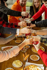 Image showing Happy co-workers celebrating while company party and corporate event