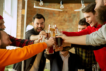 Image showing Happy co-workers celebrating while company party and corporate event