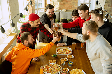 Image showing Happy co-workers celebrating while company party and corporate event