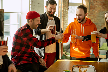 Image showing Happy co-workers celebrating while company party and corporate event