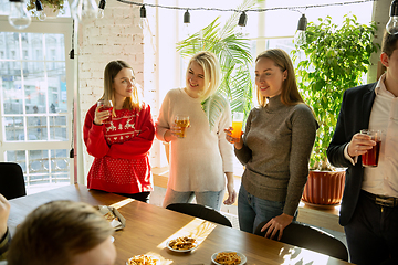 Image showing Happy co-workers celebrating while company party and corporate event