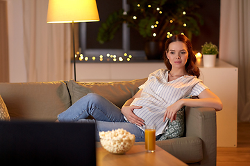 Image showing pregnant woman watching tv at home