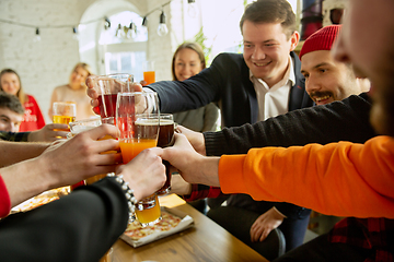 Image showing Happy co-workers celebrating while company party and corporate event