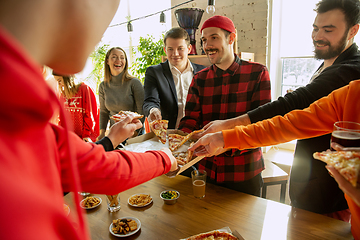 Image showing Happy co-workers celebrating while company party and corporate event