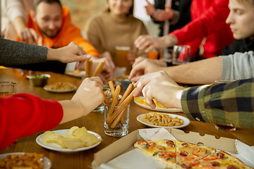 Image showing Happy co-workers celebrating while company party and corporate event