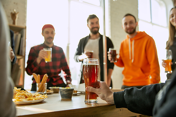 Image showing Happy co-workers celebrating while company party and corporate event