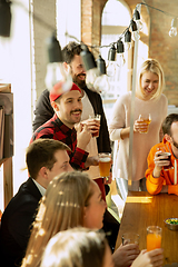 Image showing Happy co-workers celebrating while company party and corporate event