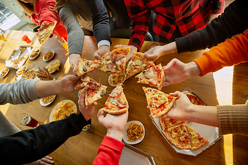 Image showing Happy co-workers celebrating while company party and corporate event