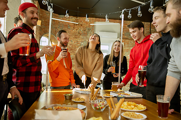 Image showing Happy co-workers celebrating while company party and corporate event