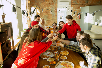 Image showing Happy co-workers celebrating while company party and corporate event