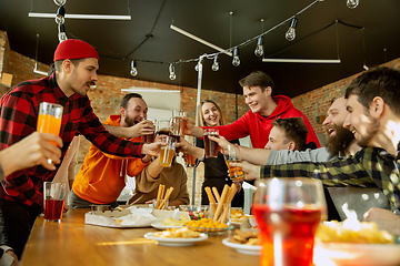 Image showing Happy co-workers celebrating while company party and corporate event