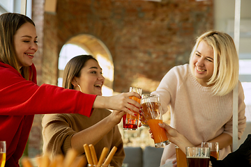 Image showing Happy co-workers celebrating while company party and corporate event