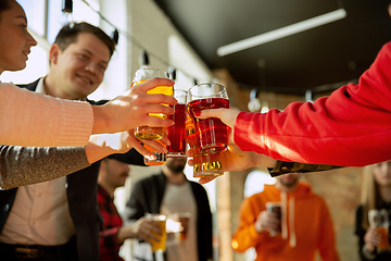 Image showing Happy co-workers celebrating while company party and corporate event