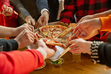 Image showing Happy co-workers celebrating while company party and corporate event