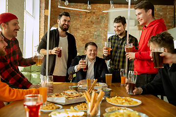 Image showing Happy co-workers celebrating while company party and corporate event