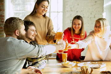 Image showing Happy co-workers celebrating while company party and corporate event