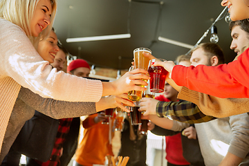 Image showing Happy co-workers celebrating while company party and corporate event