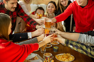 Image showing Happy co-workers celebrating while company party and corporate event