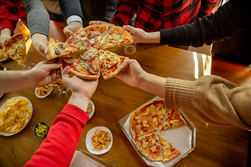 Image showing Happy co-workers celebrating while company party and corporate event